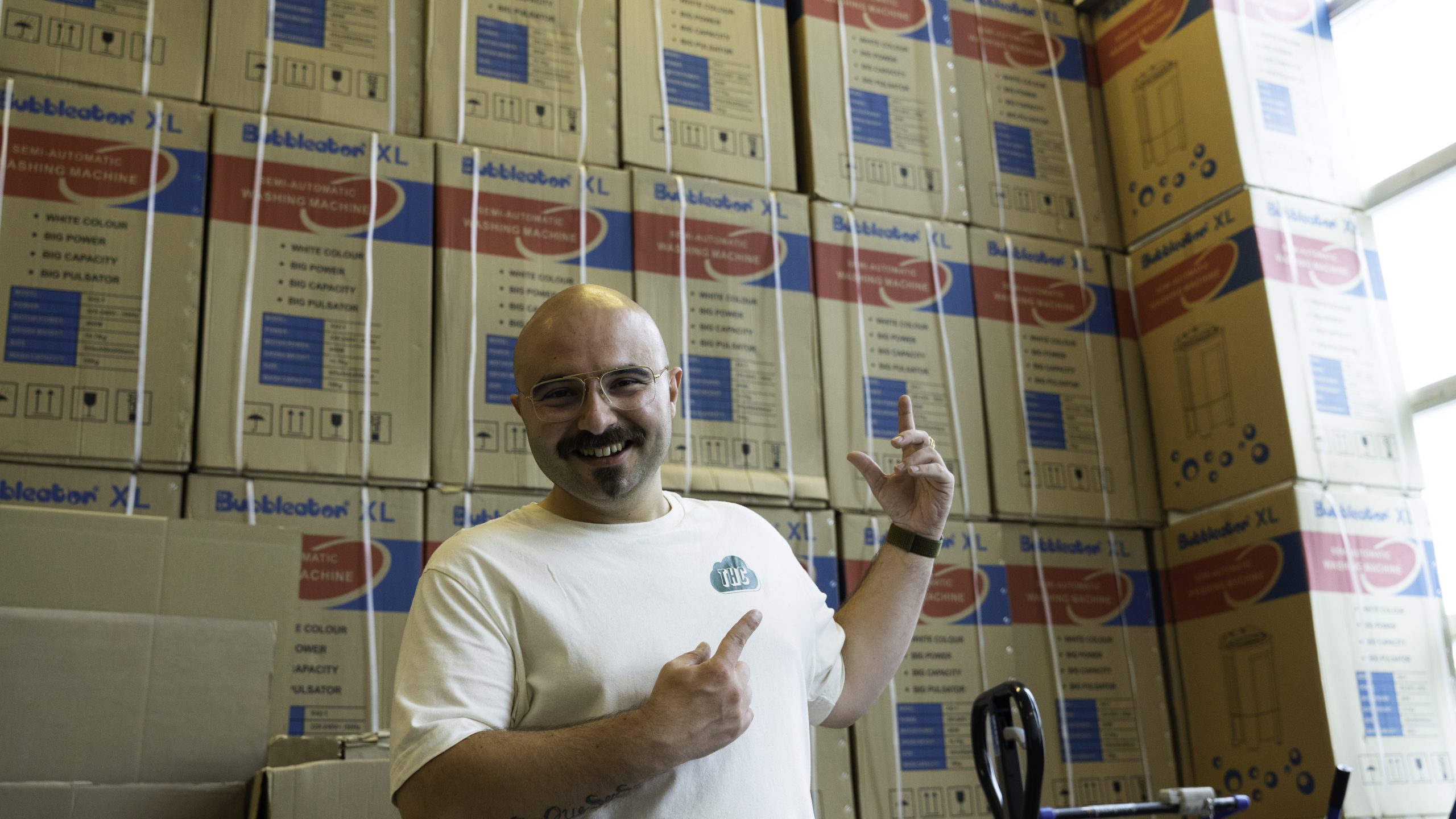 uncle kush in front of a pile of bubbleator machines